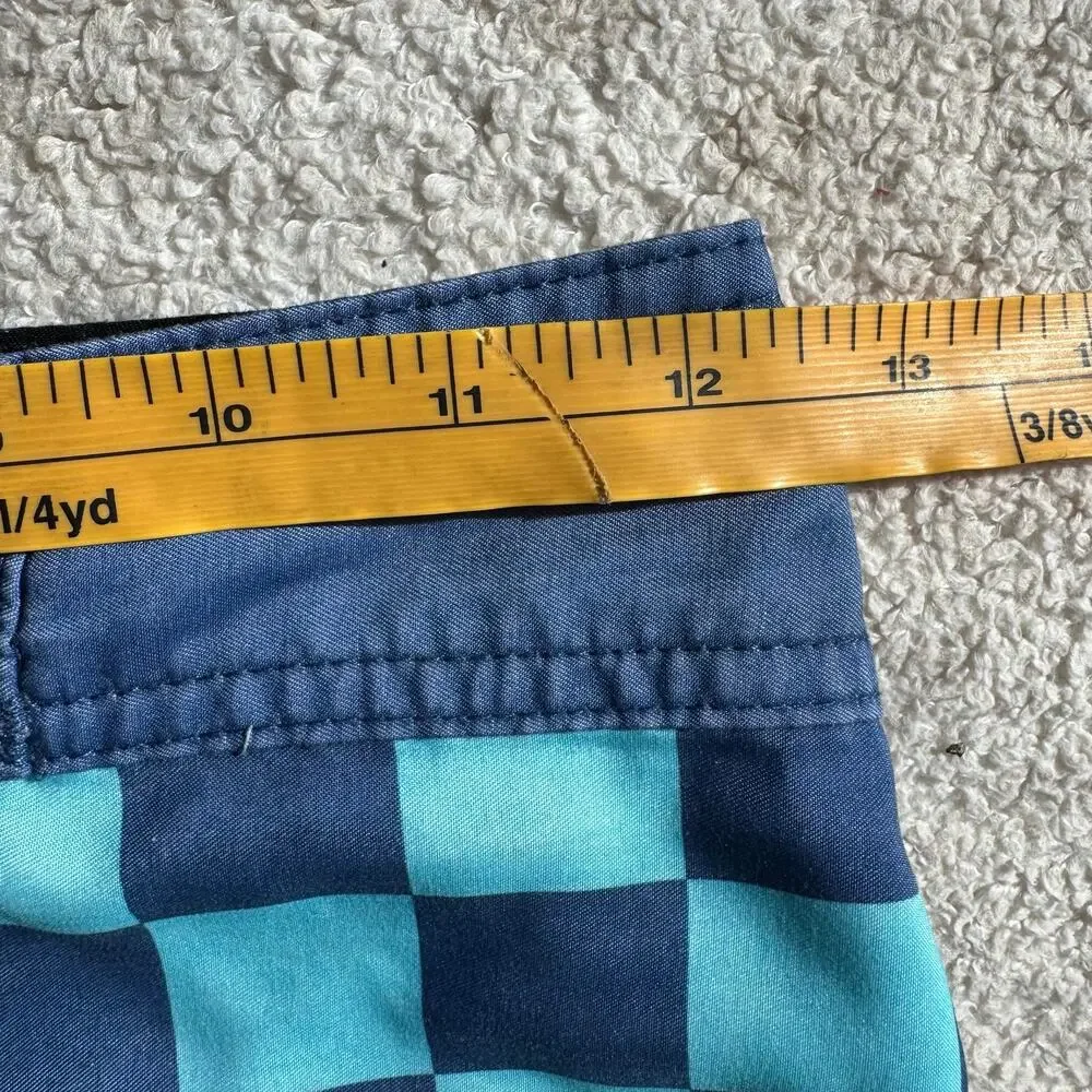 Quiksilver Board Shorts Featuring a Checkerboard Top and a Gradient Bottom